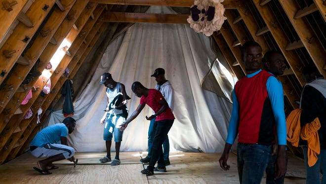 Haitian migrants are helping to build an addition onto the Desayunador Salesiano Padre Chava, a shelter in Tijuana, Mexico, which has been overwhelmed by migrants from Haiti and other countries hoping to enter the U.S. through a port of entry.