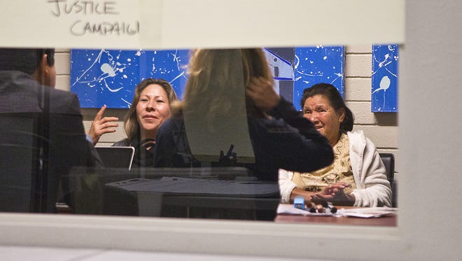 The U.S. government will pay $1 million to the family of Anastasio Hernandez Rojas, 42, an undocumented immigrant killed in 2010 by border agents near San Diego.   Here, attorneys and activists discuss the death  with Hernandez Rojas' widow, Maria Puga (left), and his mother, Maria Rojas (right).