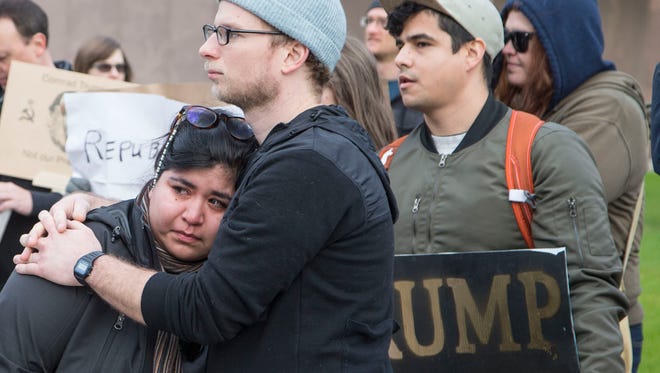 Emotions were high as several hundred demonstrators gathered at the Arizona state Capitol to protest during the inauguration of Donald Trump as the 45th president of the United States on Jan. 20, 2017, in Phoenix. Trump's election to the presidency has sparked protests across the nation since Election Day.