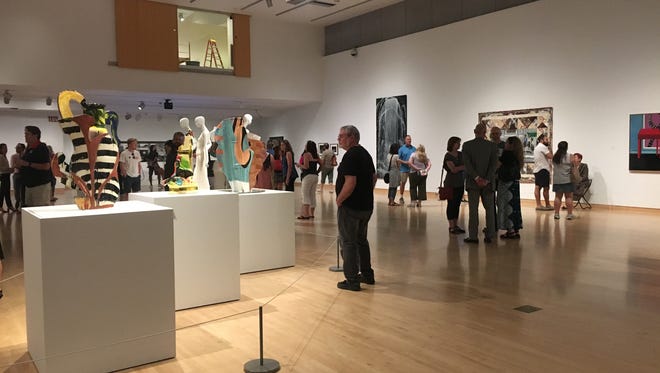 Phoenix Art Museum patrons check out the museum's newest exhibition, "In the Company of Women." Curator Rachel Sadvary Zebro said the museum wanted to dedicate an exhibition to women artists because, historically, women have been excluded from the fine art sphere.