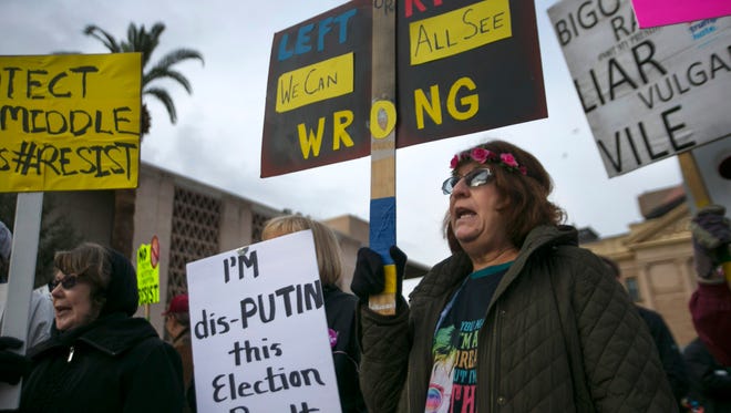 Andrea Stefanov of Sun City participates during a protest against President Donald Trump at the Arizona state Capitol in Phoenix on Jan. 20 2017. The protest occurred during President Trump's inauguration.