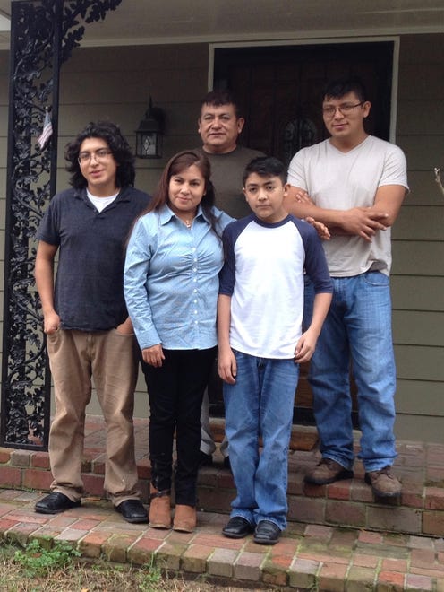 Members of the Ramos family posed for a portrait outside their home in Memphis shortly before the parents' departure in 2015. 
From left, front: Isaias Ramos, Cristina Vargas and Dustin Ramos. Back row, from left: Mario Ramos and Dennis Ramos.