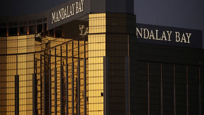 Windows are broken at the Mandalay Bay resort and casino, Tuesday, Oct. 3, 2017, in Las Vegas. Authorities said Stephen Craig Paddock broke the windows and began firing with a cache of weapons, killing dozens and injuring hundreds.
