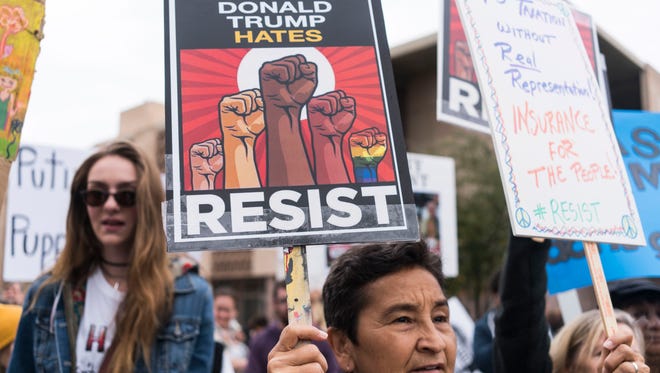 Several hundred demonstrators gathered at the Arizona state Capitol to protest during the inauguration of Donald Trump as the 45th president of the United States on Jan. 20, 2017, in Phoenix. Trump's election to the presidency has sparked protests across the nation since Election Day.