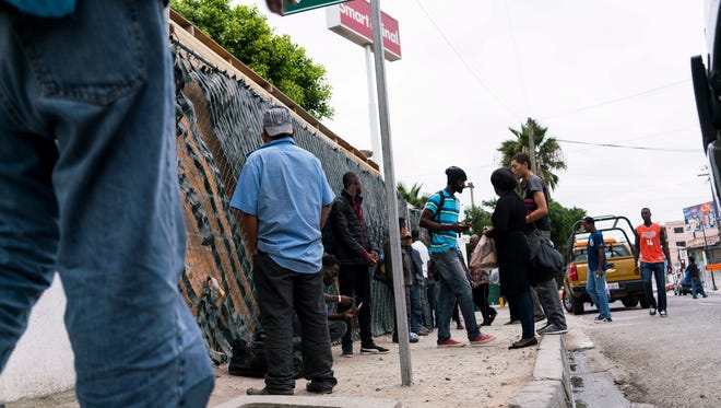 Mexican police guard the shelter after more than 5,000 Haitian refugees take shelter at Desayunador Salesiano Padre Chava, in Tijuana, Mexico, in October.