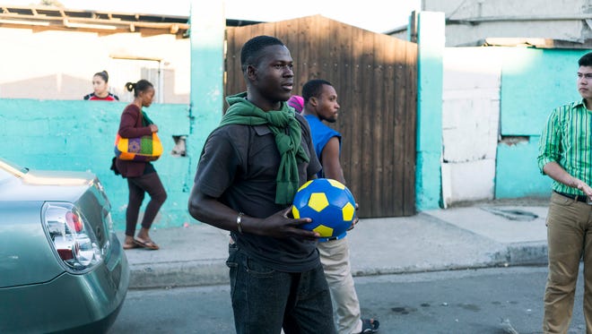 Latin American migrants headed for the U.S. have traveled through border cities in Mexico for decades, but this is the first time so many Haitians have arrived at one time. This Haitian man struck up a soccer game with some local guys in October on a street in Tijuana near a migrant shelter that has taken in hundreds of Haitian migrants hoping to cross into the U.S. through ports of entry without American visas.