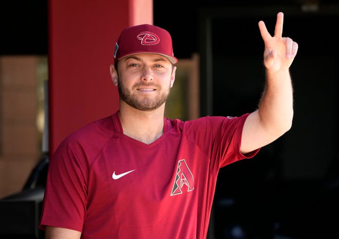 Arizona Diamondbacks pitcher Corbin Martin gestures to the photographers during spring training practice at Salt River Fields in Scottsdale on March 14, 2022.