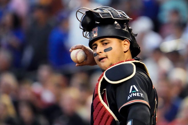 Oct 31, 2023; Phoenix, AZ, USA; Arizona Diamondbacks catcher Gabriel Moreno (14) looks on during the second inning after a wild pitch against the Texas Rangers in game four of the 2023 World Series at Chase Field. Mandatory Credit: Rob Schumacher-Arizona Republic