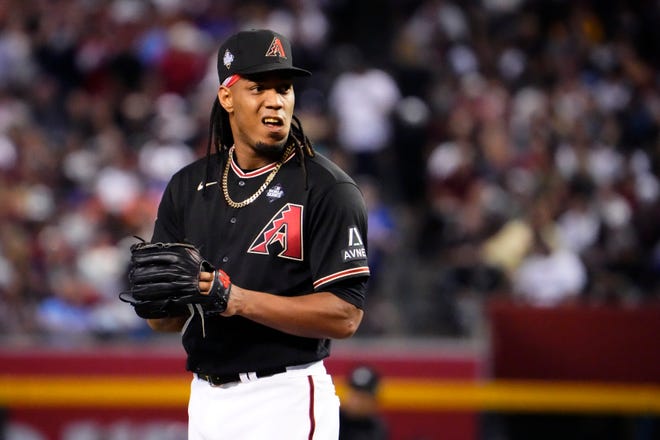Oct 31, 2023; Phoenix, AZ, USA; Arizona Diamondbacks relief pitcher Luis Frias (65) looks on during the third inning against the Texas Rangers in game four of the 2023 World Series at Chase Field. Mandatory Credit: Rob Schumacher-Arizona Republic