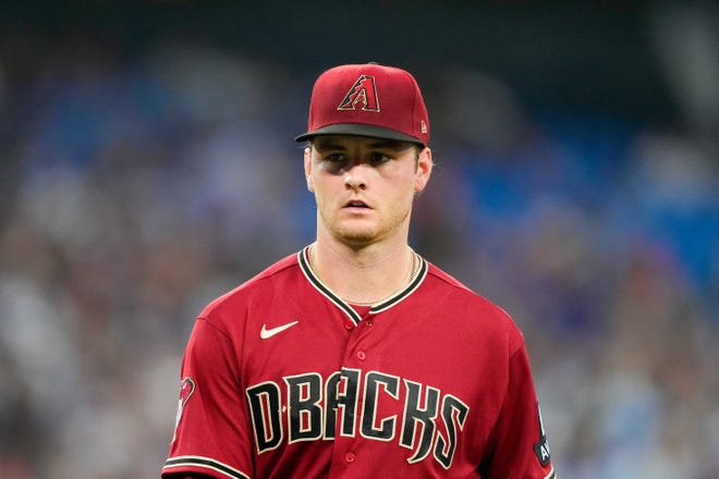 Arizona Diamondbacks starting pitcher Ryne Nelson (19) walks back to the dugout at an MLB game against the Toronto Blue Jays at Rogers Centre in Toronto on July 14, 2023.
