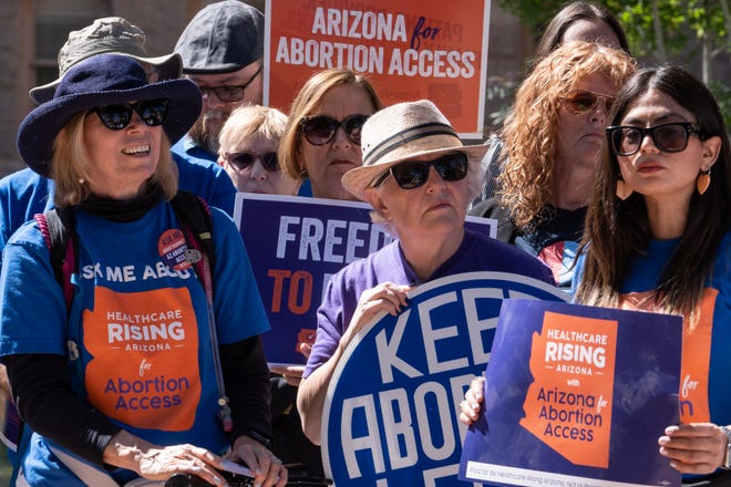 Abortion rights activists attend a news conference addressing the Arizona Supreme Court's ruling to uphold a 160-year-old near-total abortion ban at the Arizona state Capitol in Phoenix on April 9, 2024.