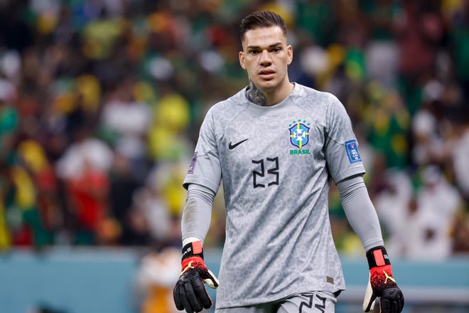 Dec 2, 2022; Lusail, Qatar; Brazil goalkeeper Ederson (23) stands on the field in the match against Cameroon in the second half during a group stage match during the 2022 World Cup at Lusail Stadium. Mandatory Credit: Yukihito Taguchi-USA TODAY Sports