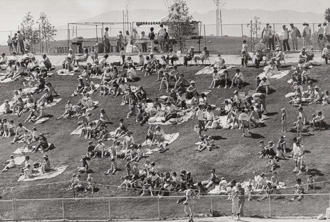 Baseball fans who wish to only pay $2 for a seat can spread their own blanket on the lawn in a special section during spring training between the San Diego Padres and Milwaukee Brewers on March 11, 1987.