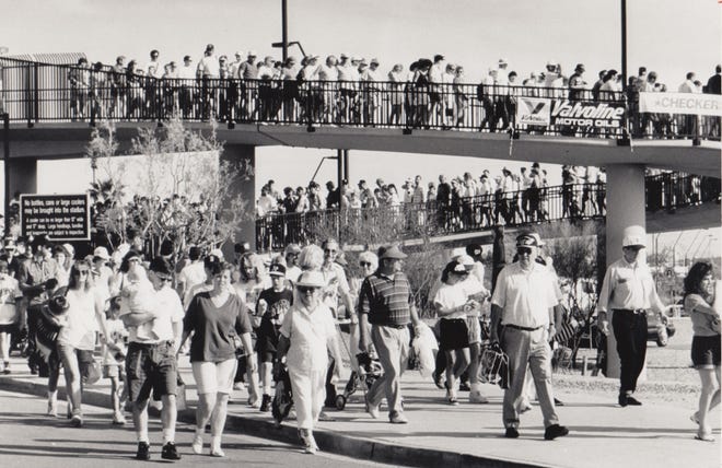 Thousands of fans leave Phoenix Municipal Stadium after a spring training game March 3, 1992.