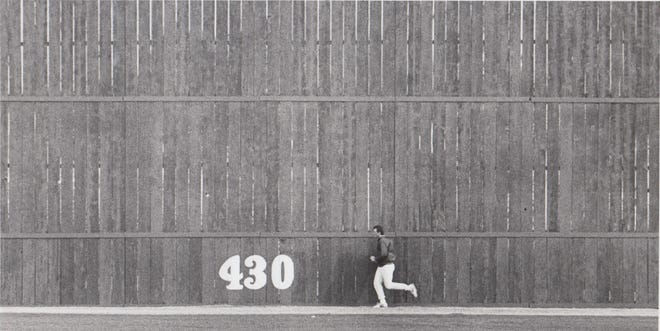 San Diego Padres pitcher Matt Maysey runs along a fence during spring training Feb. 7, 1989.