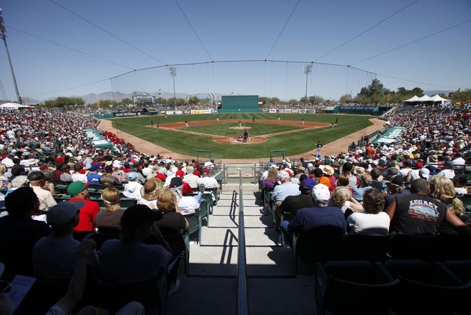 Fans in 2010 watch at Tucson Electric Park as the Milwaukee Brewers play the Arizona Diamondbacks. The D-Backs and the Colorado Rockies moved their spring training to the Phoenix-area the following year.