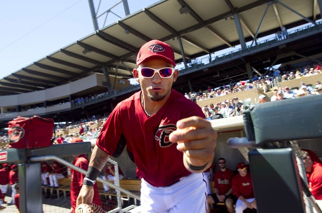 Diamondbacks outfielder Gerardo Parra takes the field at the start of the Cactus League spring-training game against the Brewers at Salt River Fields at Talking Stick on the Salt River Pima Maricopa Indian Community on March 21, 2012.