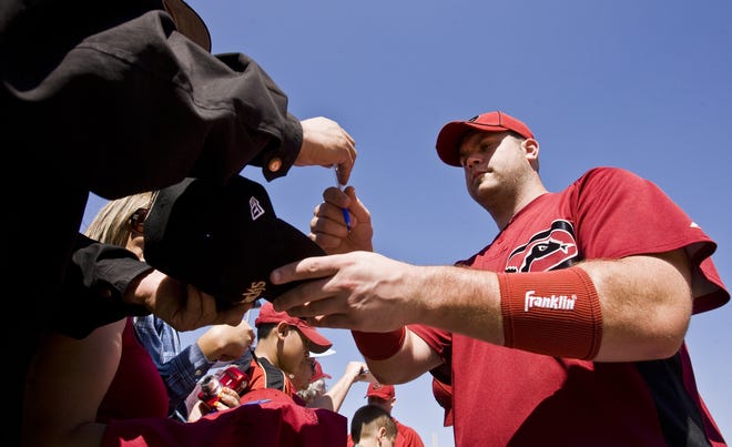 Catcher Chris Snyder signs autographs for fans at Tucson Electric Park on March 4, 2010. The Arizona Diamondbacks play host to the Colorado Rockies in the teams' first Cactus League spring-training game. Both teams are in the final year of their associations with Tucson, as both teams will move to a new facility in Scottsdale for the 2011 season.