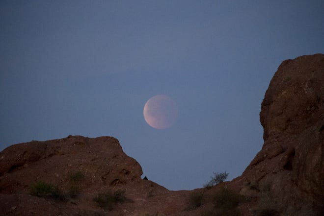 The super blood blue moon on Jan. 31, 2018, over Papago Park in Phoenix, Ariz.