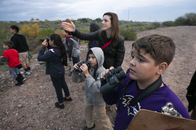 Arjan Hyseni, 11, and other kids from the Tri-City West Thornwood Branch of Avondale of the Boys & Girls Clubs of Metro Phoenix bird-watch at the Nina Mason Pulliam Rio Salado Audubon Center in Phoenix on Dec. 6, 2018. "Arizona's River Keepers" is an after-school program for third- through sixth-graders to expose them to the different plants and animals in the Salt River area just south of downtown Phoenix.