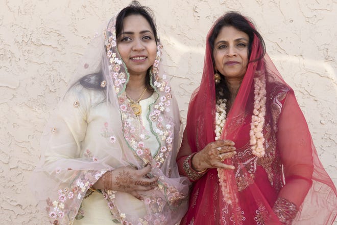 Farzana Salahudeen (left) and Julaiha Ariff both from Chennai, india, attend the Eid prayer at United Islamic Center of Arizona in Glendale on June 4, 2019.