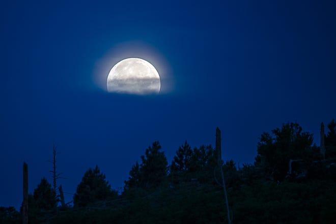 Watching the Strawberry Full Moon descend on Monday morning from the Mogollon Rim.