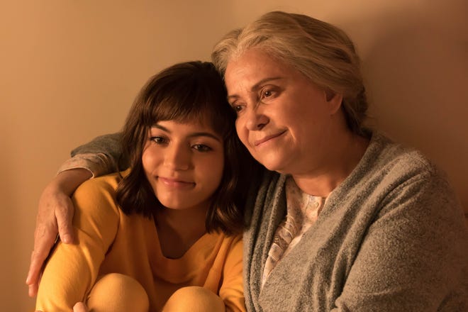 In "Dora and the Lost City of Gold," Dora (Isabela Moner) is comforted by her grandmother (Adriana Barraza).