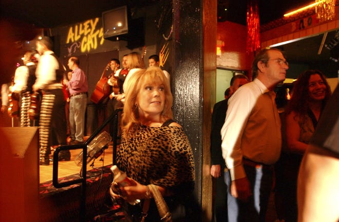 Vikki Carr and actor Tommy Lee Jones prepare to go onstage on Sept. 25, 2005, in San Antonio. It was a benefit for Hurricane Katrina survivors.