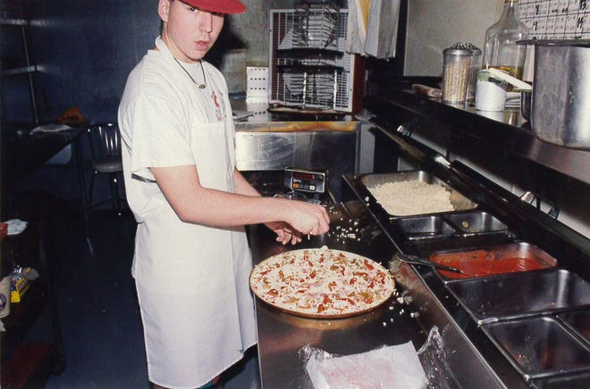 Anthony Spinato making a pizza.