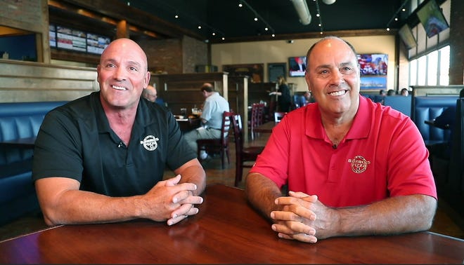 Bruce (left) and Mike Barro are two of the four sibling who own Barro's Pizza.