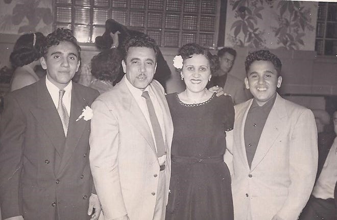 James and Angelina Barro (center) with their sons Angelo (left) and John in Chicago.