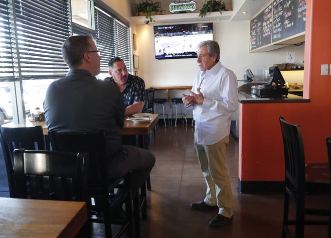 Dan Mei, owner of Nello's Pizza in Ahwatukee, chats with customers in his restaurant on Nov. 1, 2019. He says his restaurant is successful in part from traditions brought over when his family immigrated from Italy.
