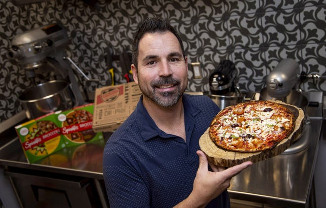 Anthony Spinato carries on the family tradition of Spinato's Pizzeria. He poses at the corporate offices in Tempe on Nov. 14, 2019.