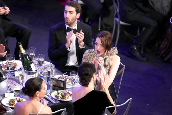 Emma Stone and Dave McCary react to a win at the Screen Actors Guild Awards on January 27, 2019 in Los Angeles.