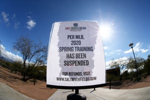 A sign announces that Major League Baseball has suspended the 2020 spring training season, this is in response to the COVID-19 virus health emergency on March 13, 2020 at Salt River Fields at Talking Stick in Scottsdale.
