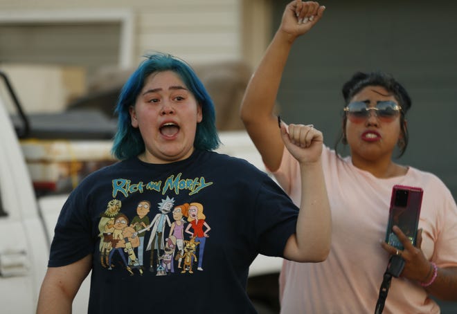 James Garcia's sister thanks marchers during a Justice for James Garcia Rally in Phoenix on July 6, 2020.