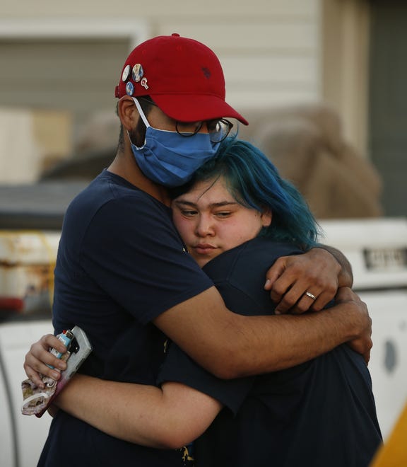 James Garcia's sister receives a hug during a Justice for James Garcia Rally in Phoenix on July 6, 2020.