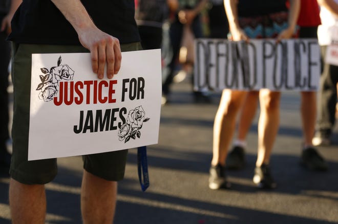 People gather in support during a Justice for James Garcia Rally in Phoenix on July 6, 2020.