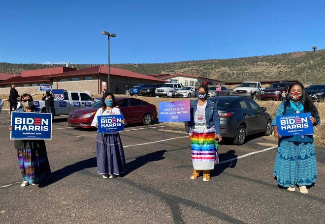 (From left to right) Dr. Rea Goklish, Dawnafe Whitesinger, Jandi Craig, and Eileen Crocker from Bii'Nalwod pose for a picture near the polling site on the White Mountain Apache Nation in Whiteriver, Arizona.