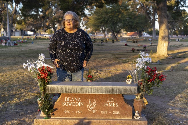 Leslie Bowdoin James visits her sister Deana Bowdoin's gravesite at Greenwood Memory Lawn Mortuary and Cemetery in Phoenix on Jan. 14, 2021.