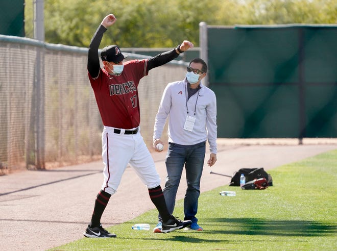 Arizona Diamondbacks manager Torey Lovullo and assistant GM Amiel Sawdaye (right) during spring training workouts at Salt River Fields at Talking Stick in Scottsdale, Ariz., on Feb. 26, 2021.