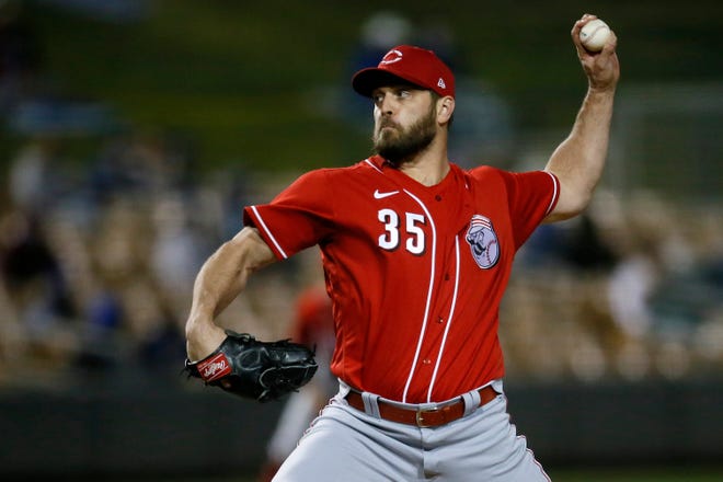 Cincinnati Reds pitcher Chris Osich (35) throws a pitch in the sixth inning of the MLB Cactus League Spring Training game between the Los Angeles Dodgers and the Cincinnati Reds at Camelback Ranch in Glendale, Ariz., on Wednesday, March 3, 2021. The seven-inning game ended in a 4-4 tie.