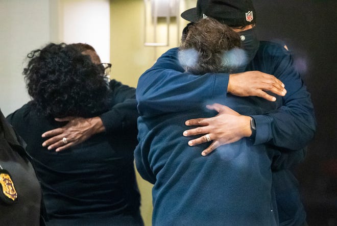 People hug after learning that their loved one is safe after a shooting inside a FedEx building Friday, April 16, 2021. Multiple people were shot and killed in a late-night shooting at a FedEx facility in Indianapolis, and the shooter killed himself, police said.(The Indianapolis Star via AP)