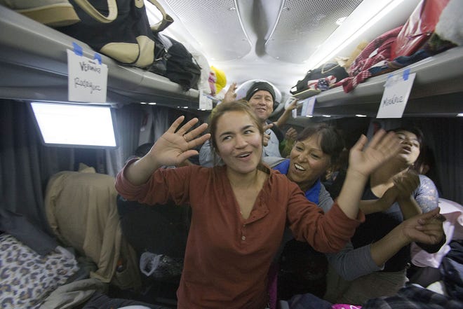 Montserrat Arredondo dances on a bus after an Arizona delegation pressed Congress for immigration reform on Oct. 26, 2013.