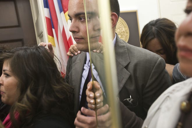 In 2013, Eduardo Sainz cries as Dreamers pray outside House Speaker John Boehner's office in Washington.
