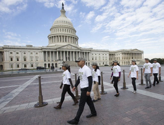 Hassan Quiz, in front, marches at Capitol Hill in 2013.