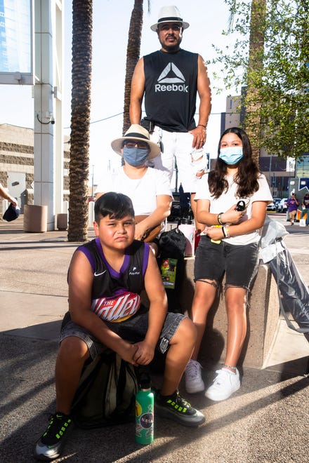The Guerrero family poses at the Phoenix Suns Arena for Game 2 of the NBA finals vs. the Milwaukee Bucks on July 8, 2021.