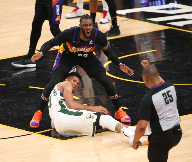 Phoenix Suns forward Jae Crowder (99) argues a foul call by referee Tony Brothers (25) for Milwaukee Bucks forward Giannis Antetokounmpo (34) during Game 2 of the NBA Finals at Phoenix Suns Arena July 8, 2021.