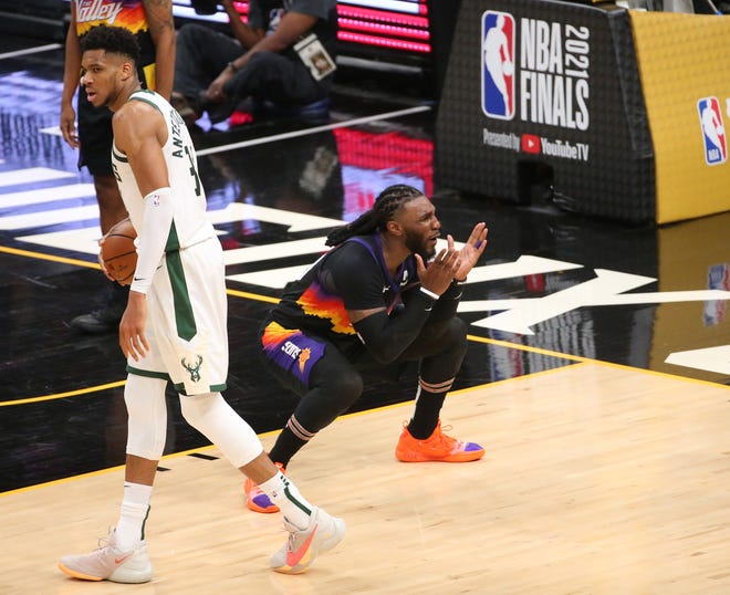 Phoenix Suns forward Jae Crowder (99) reacts to a foul call against Milwaukee Bucks forward Giannis Antetokounmpo (34) during Game 2 of the NBA Finals at Phoenix Suns Arena July 8, 2021.