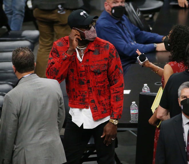 Three-time NBA champion Dwayne Wade leaves after watching Game 2 of the NBA Finals between the Phoenix Suns and the Milwaukee Bucks at Phoenix Suns Arena July 8, 2021.